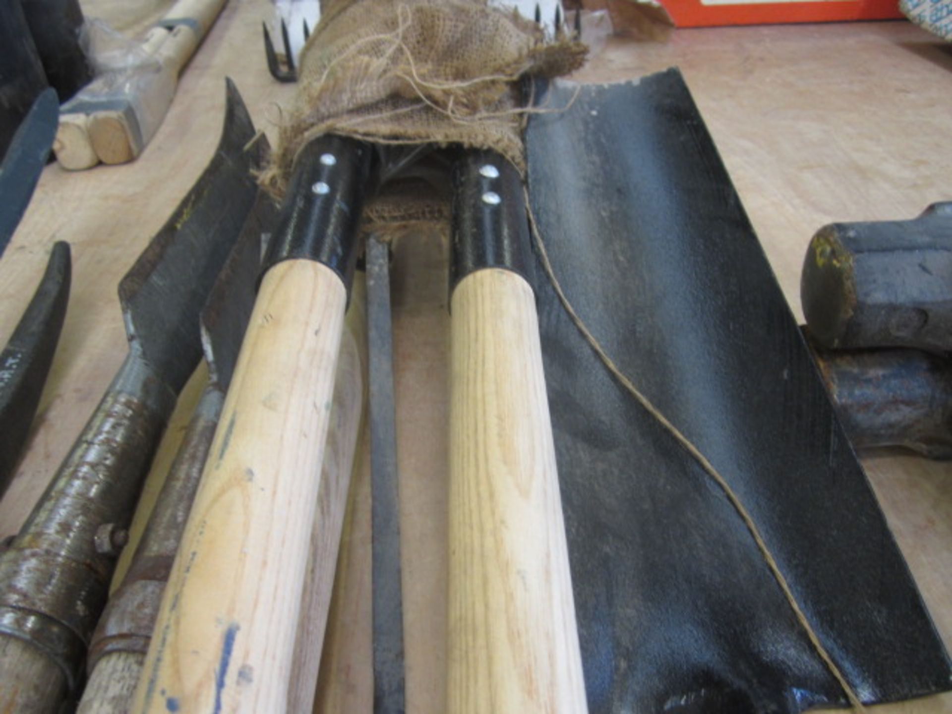 Quantity of assorted pick axe heads and handles, 4 x sledge hammers, posthole shovels, forks etc. - Image 3 of 4