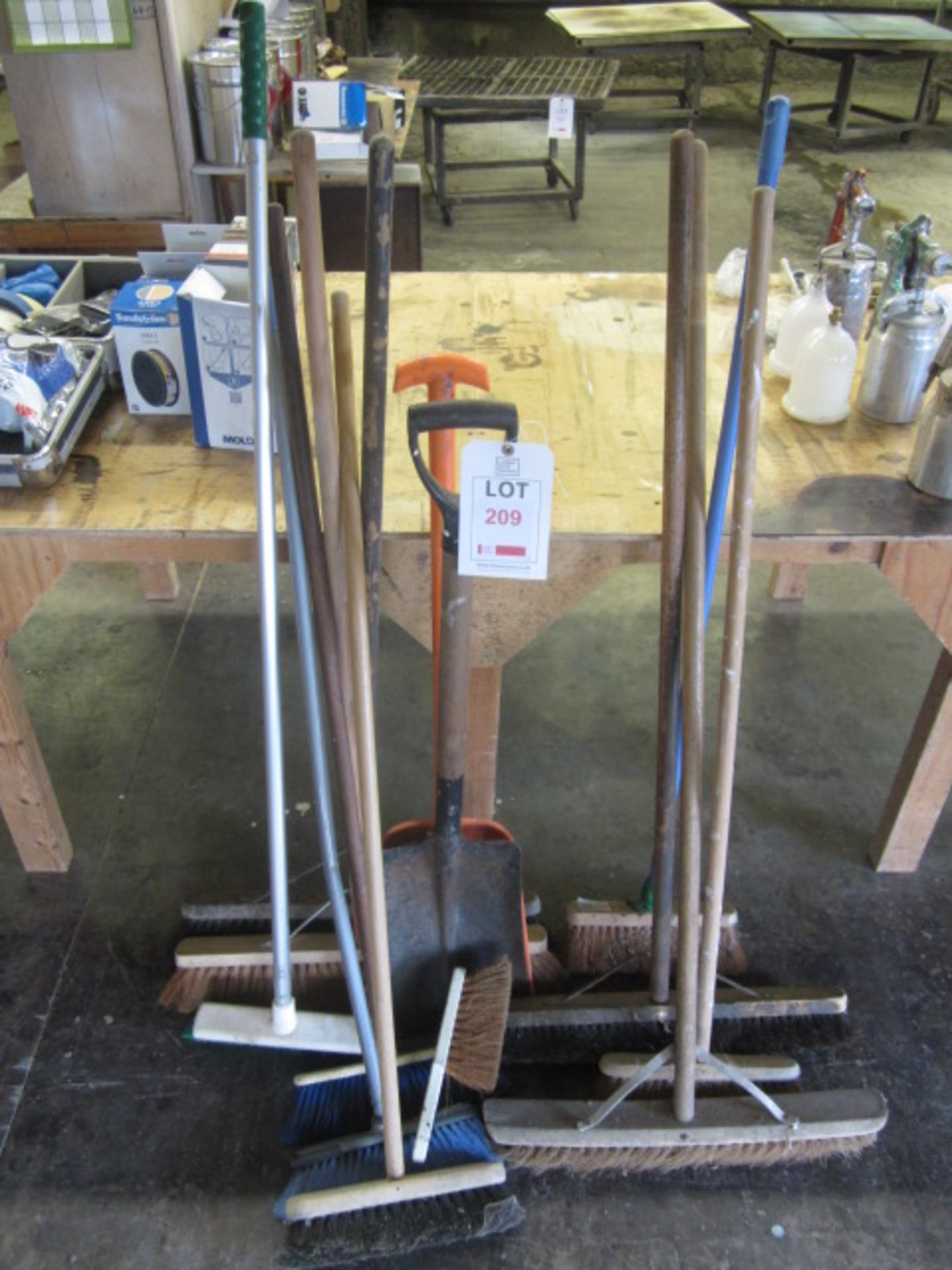 Assorted yard brushes, shovels, etc.