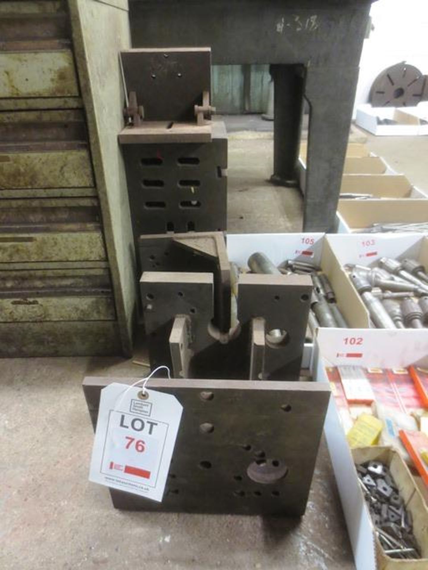 Five assorted angle/box iron pieces