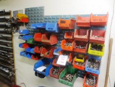 Quantity of various used Iveco/CAT engine bolts, includes plastic tote bins and steel wall hanger