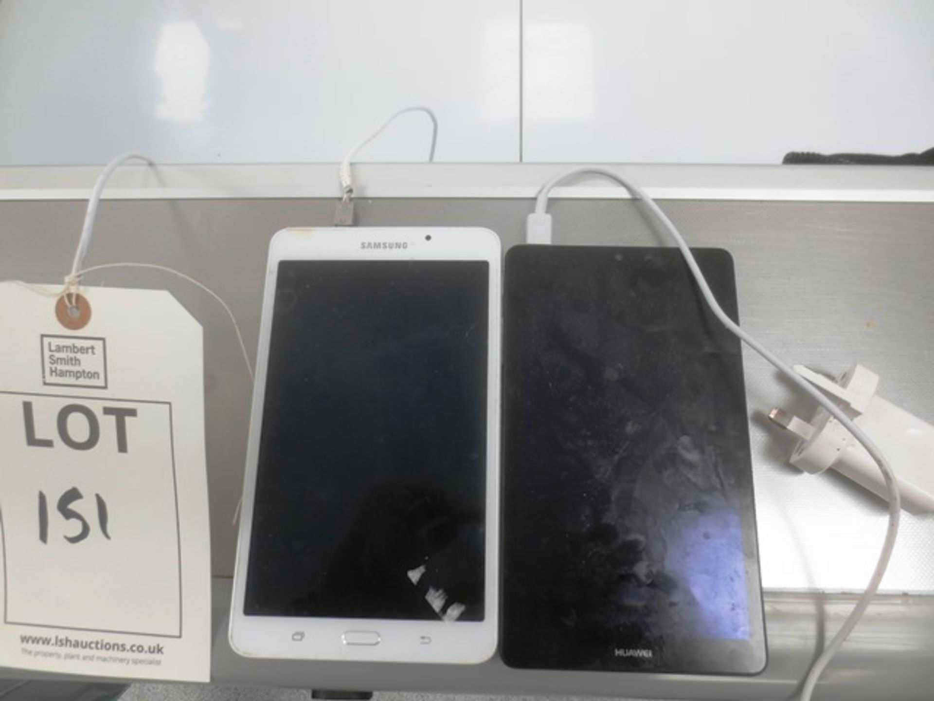 Samsung SM-T280 tablet and Huawei BG2-W09 tablet, with chargers