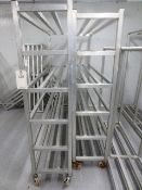Two stainless steel mobile storage racks, approx 1500 x 450mm
