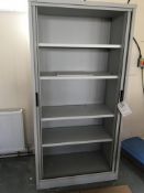 Three tambour fronted cabinets (contents not included)