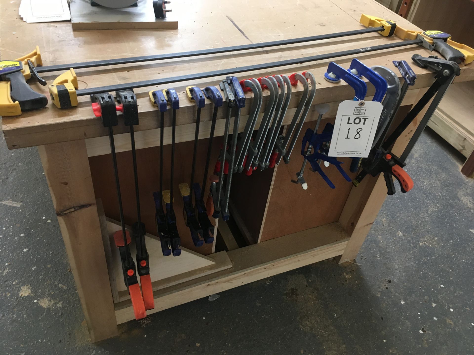 Twenty four various clamps