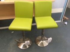 Two adjustable height lime green leather effect upholstered bar stools