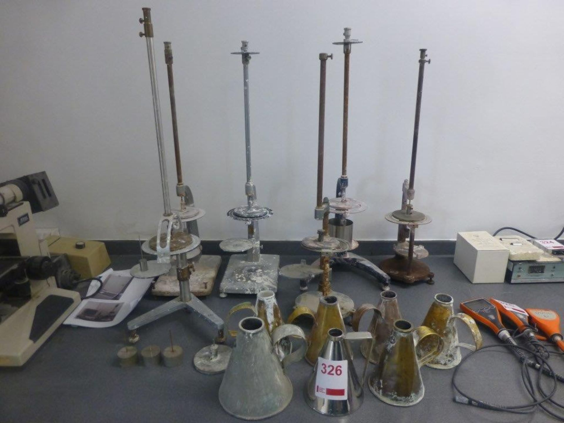 6 assorted torsion viscometers with 6 pint 7 measuring vessels and a quart measuring vessel