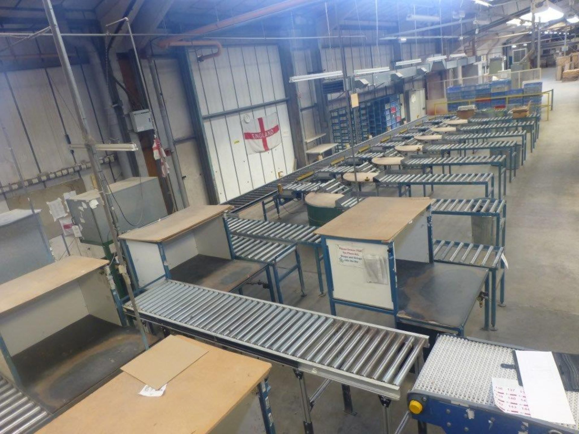 Co-Bam packing conveyor system comprising 7 packing stations with stop/diverter units and tilt