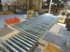 2 sections 5.4m x 700mm gravity fed roller conveyor and 3 assorted steel framed tables