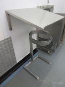 Angled stainless steel shelf and a stainless steel waste stand