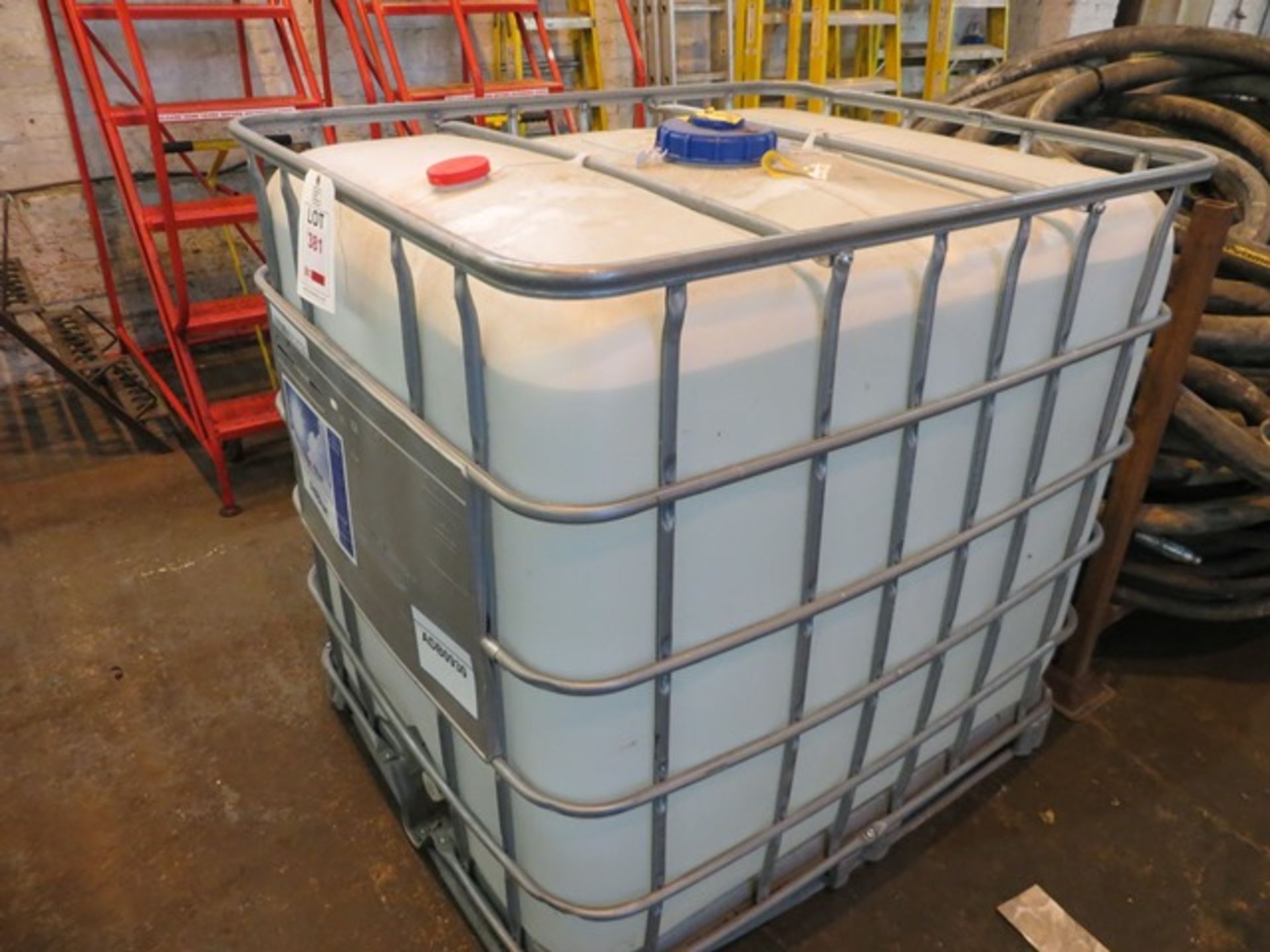 Unused IBC container containing 1000 litres of Clean Air Blue AD BLUE