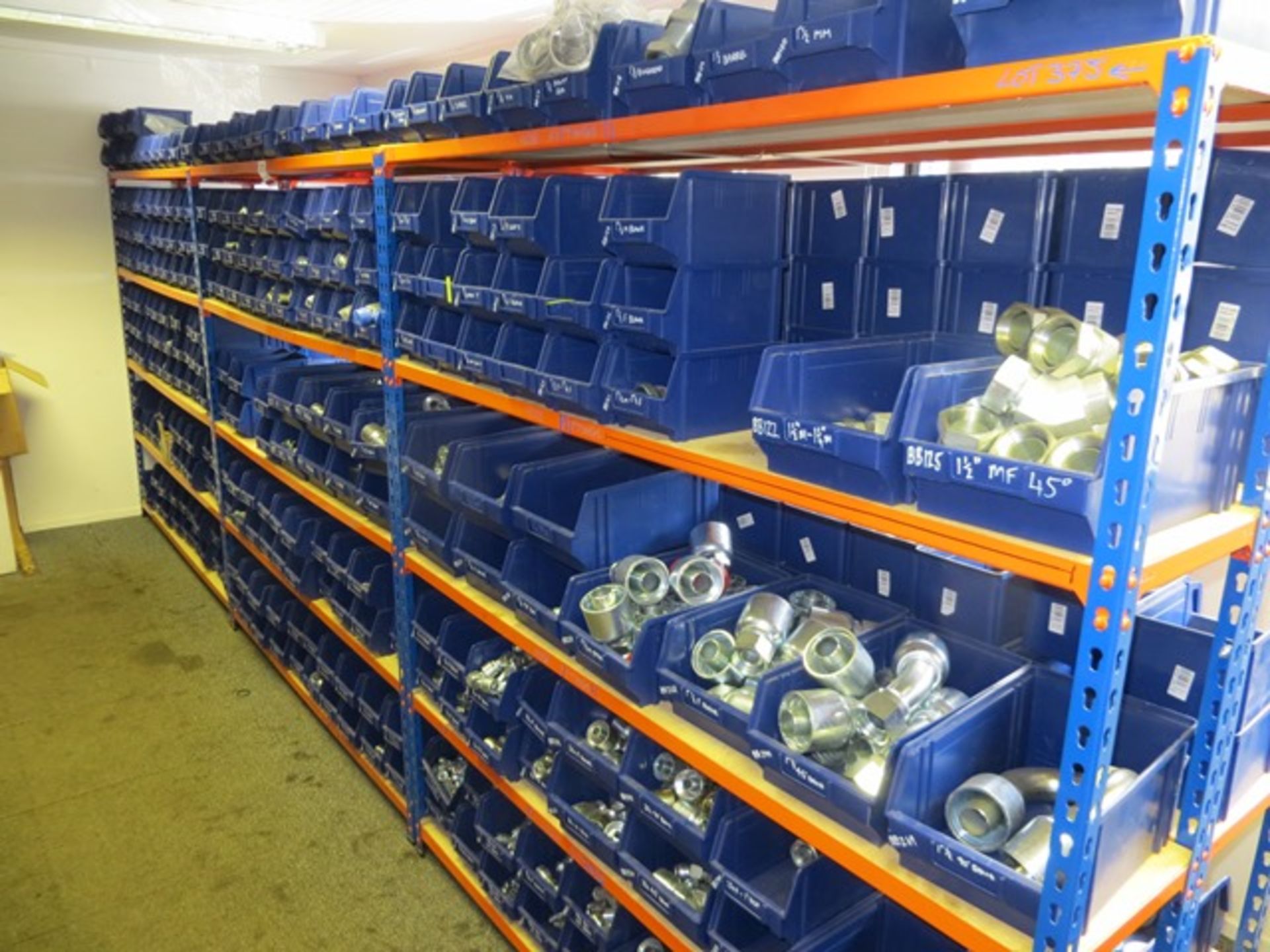 Three bays of slot together racking c/w large quantity of BSP & Metric hydraulic fittings & crimp