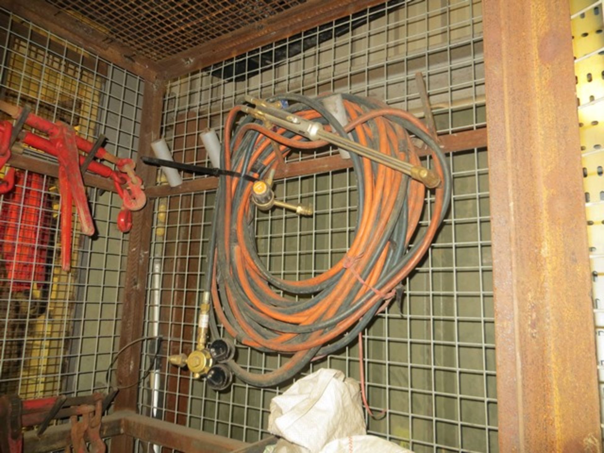 Contents of cage to include cutting torch with gauges, various chain tensioning ratchet straps, fall - Image 3 of 4