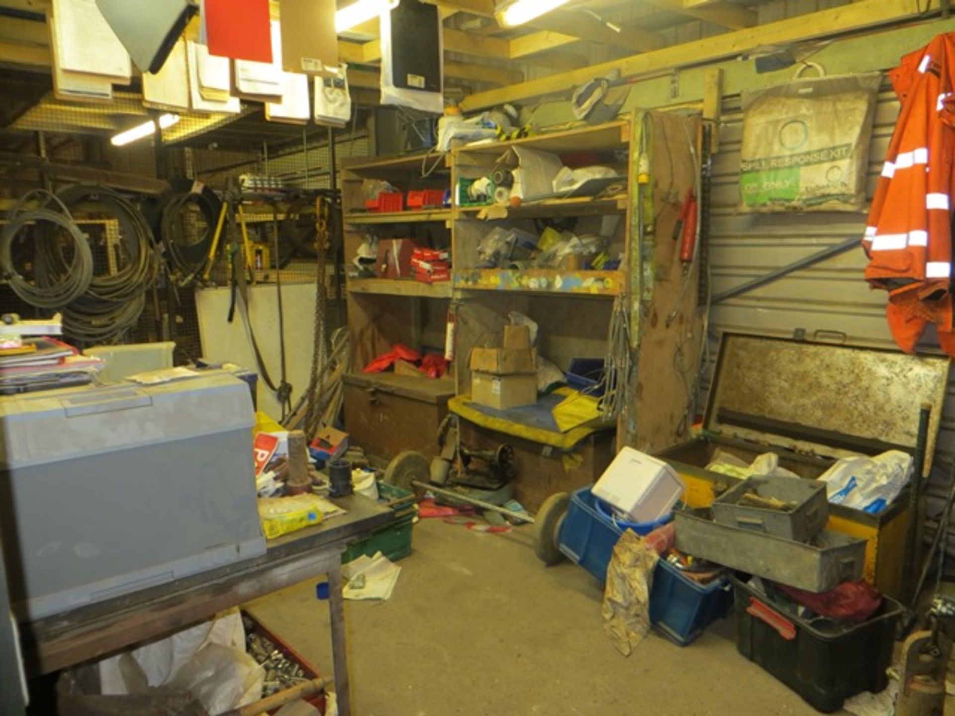 Contents of cage to include workbench & vice, 3 tool chests, various hand tools, wire rope etc.,