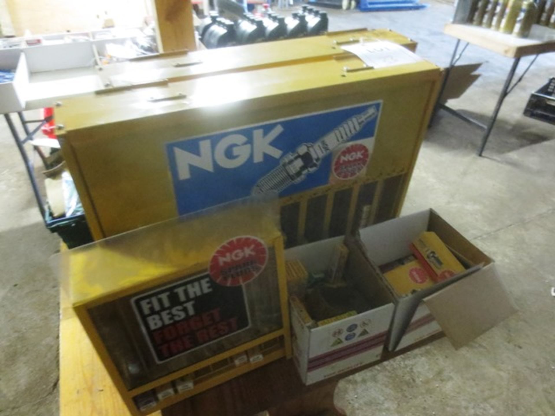 Quantity of NGK spark plugs and three steel dispensers