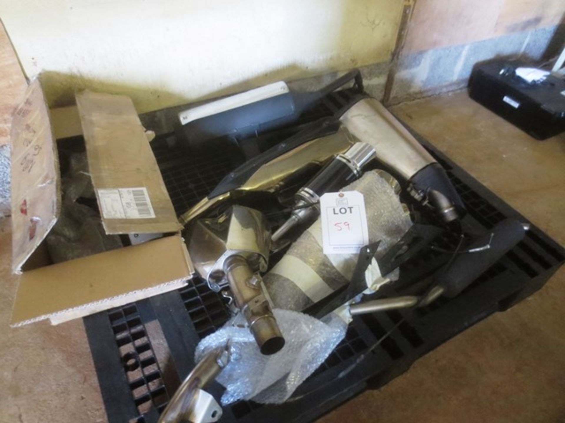 Contents of pallet to include eight various Kawasaki etc. cans/exhaust mufflers