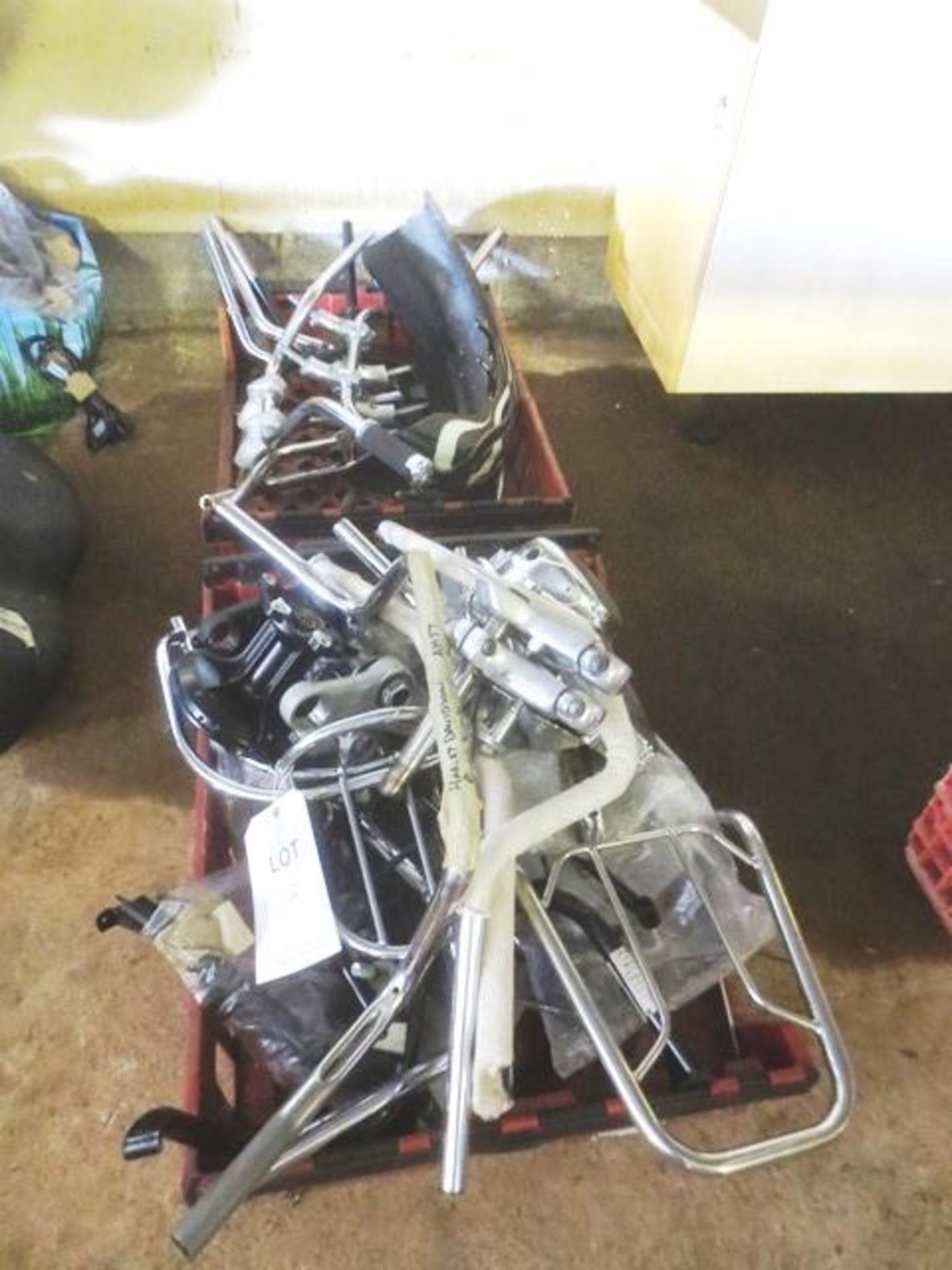 Contents of two crates to include various handle bars, fork brackets, etc. (as lotted)