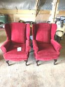 Two red wing back chairs