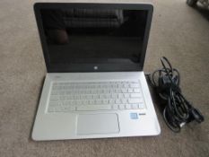 HP Envy laptop incorporating Bang Olufsen Audio and Intel i7 processor with mains lead