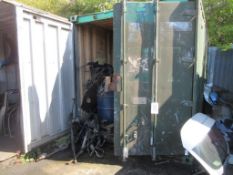 Green steel shipping container, 18 ft. x 8 ft. approx. plus rack and contents of mainly Ford parts