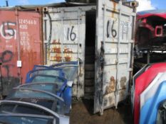Grey/white steel shipping container, 40 ft. x 8 ft. approx. plus racks and contents including tyres,