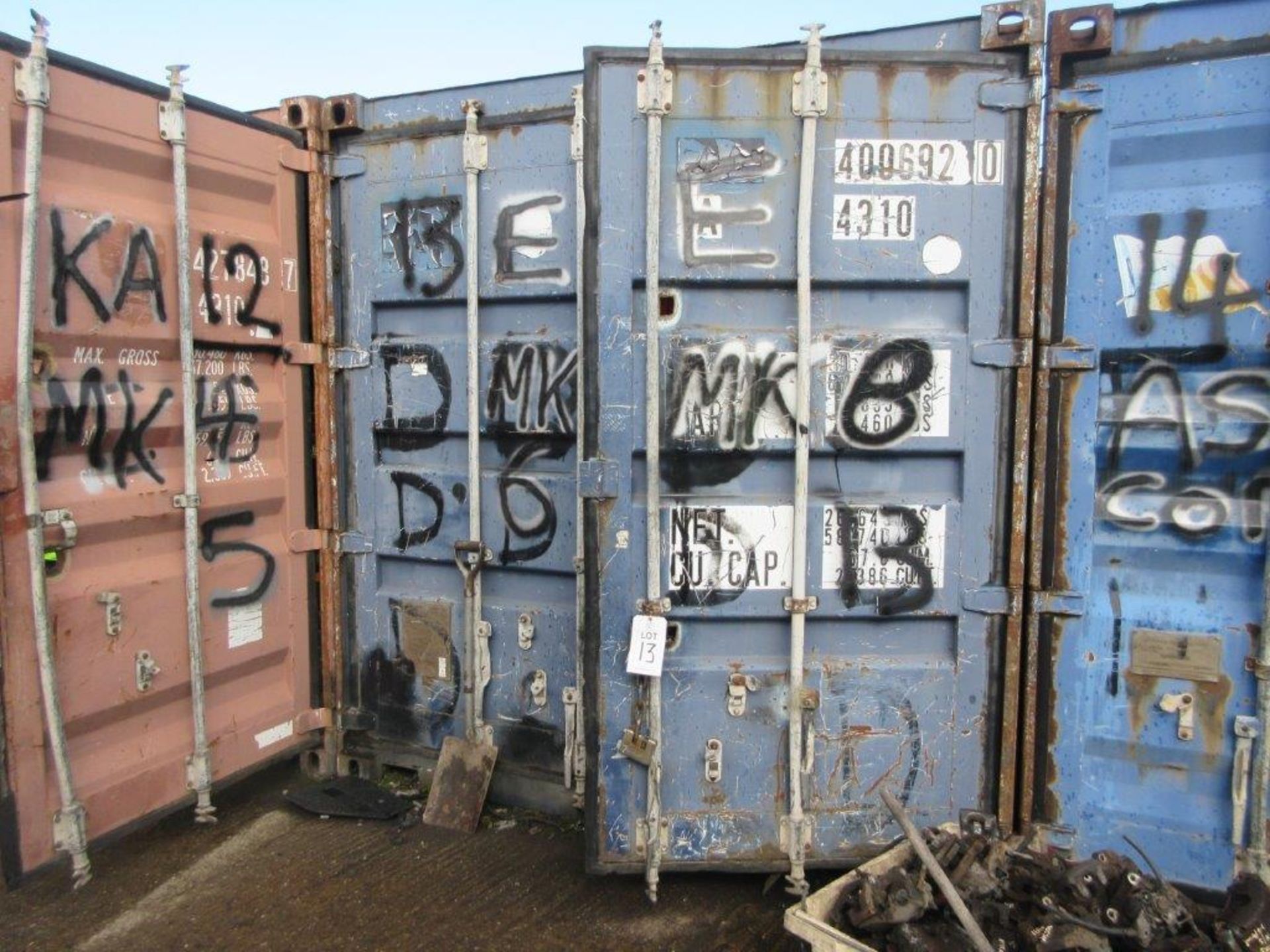 Blue steel shipping container, 40 ft. x 8 ft. approx. plus rack and contents of mainly Ford Fiesta