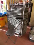 Forty metal framed plastic folding chairs c/w mobile storage unit