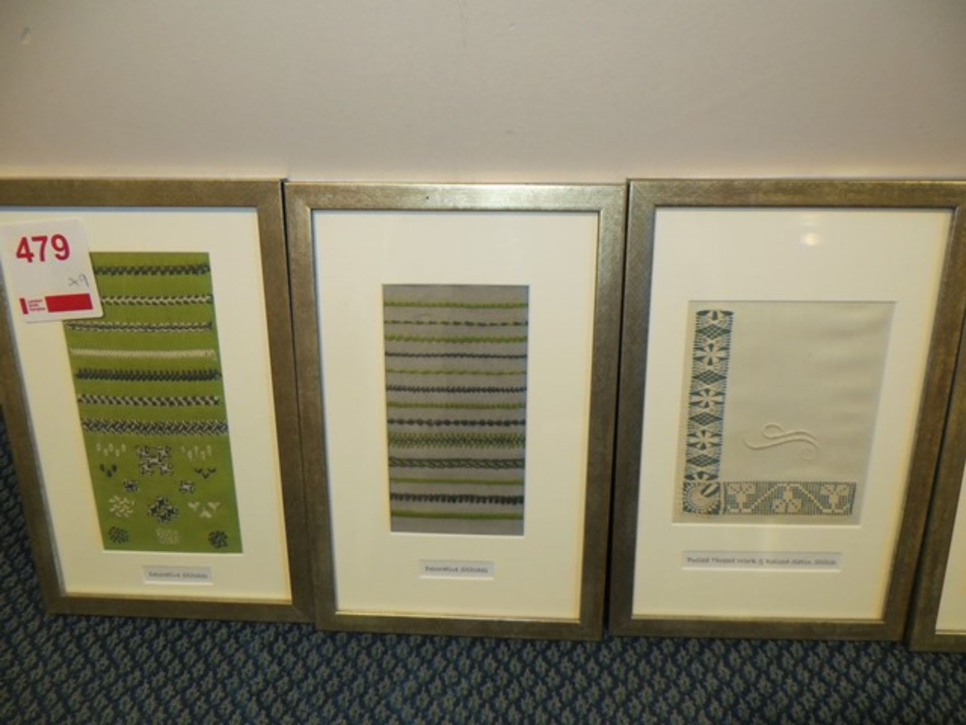 Nine matching framed samples to include 2 decorative stitches, pulled thread work and raised satin