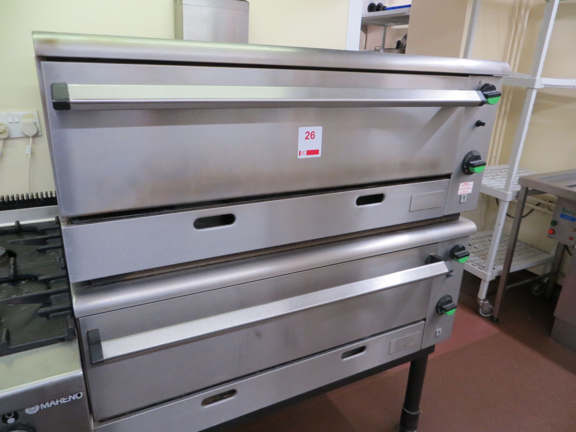 Two Falcon stainless steel gas pizza ovens (joined) c/w stand. NB A work Method Statement and Risk