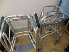 Four various height adjustable mobile walking frames & one folding frame