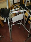 Two height adjustable mobile walking frames with arm rests