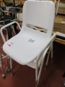 Two height adjustable shower chairs