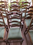 Four matching green cloth dining chairs