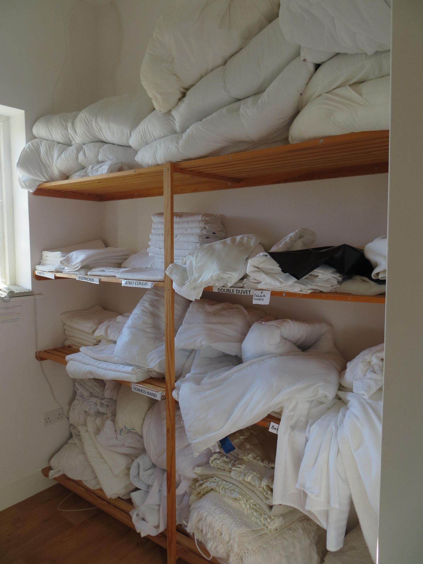 Contents of linen room to include duvets, bed sheets, towels, blankets & toiletries as lotted