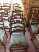 Four matching green cloth dining chairs