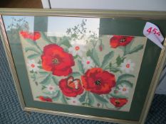 Two framed flower tapestries