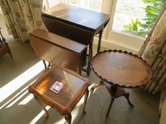 Two coffee tables, two small drop leaf tables & a three tier table