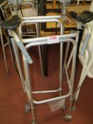 Two height adjustable mobile walking frames with arm rests