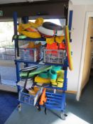 4 tier mobile shelving unit c/w large quantity of swimming aids, floats, life jackets, spine board