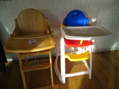 Wood framed childs high chair and a plastic framed childs high chair