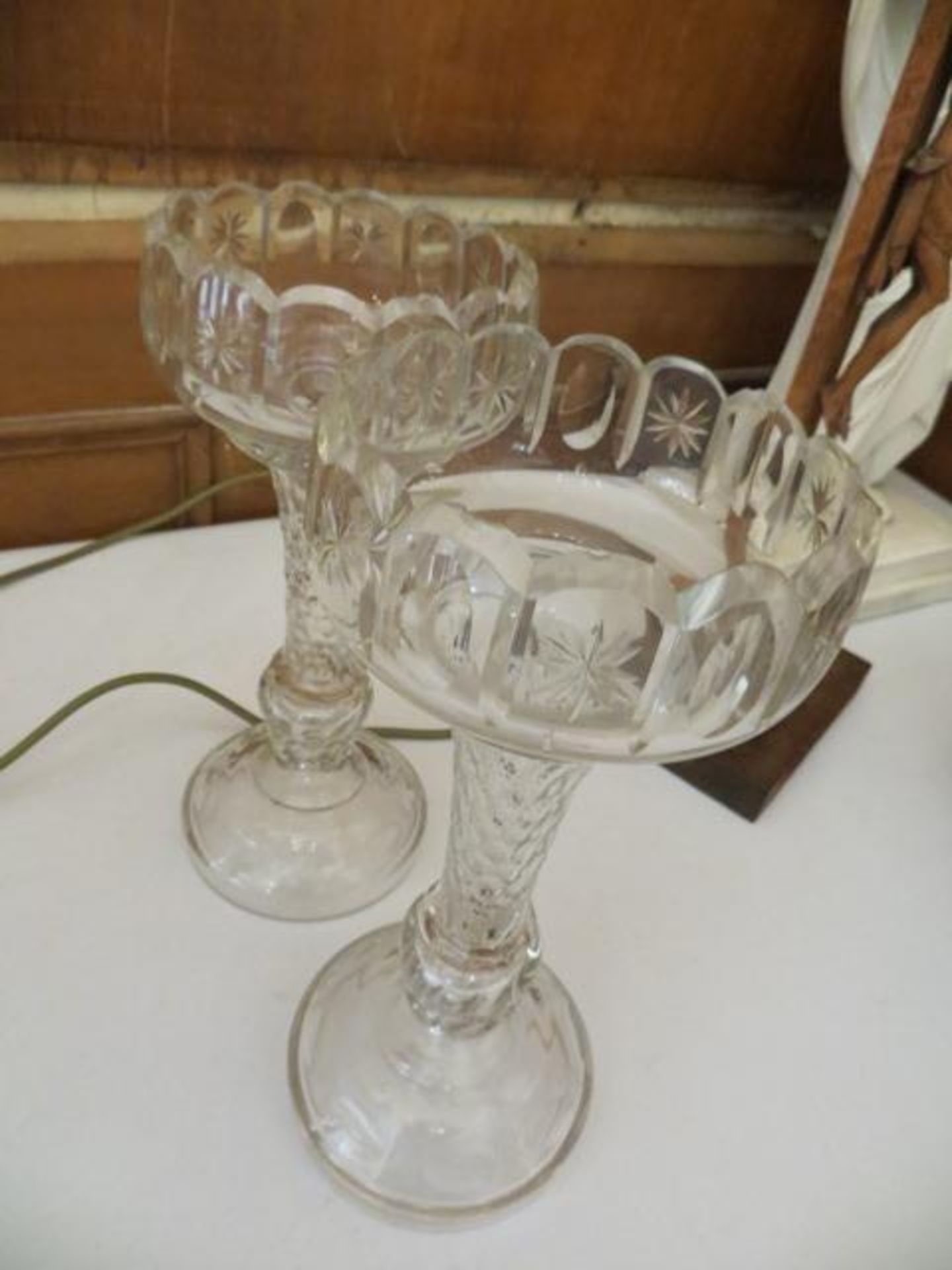 Two matching cut glass vases