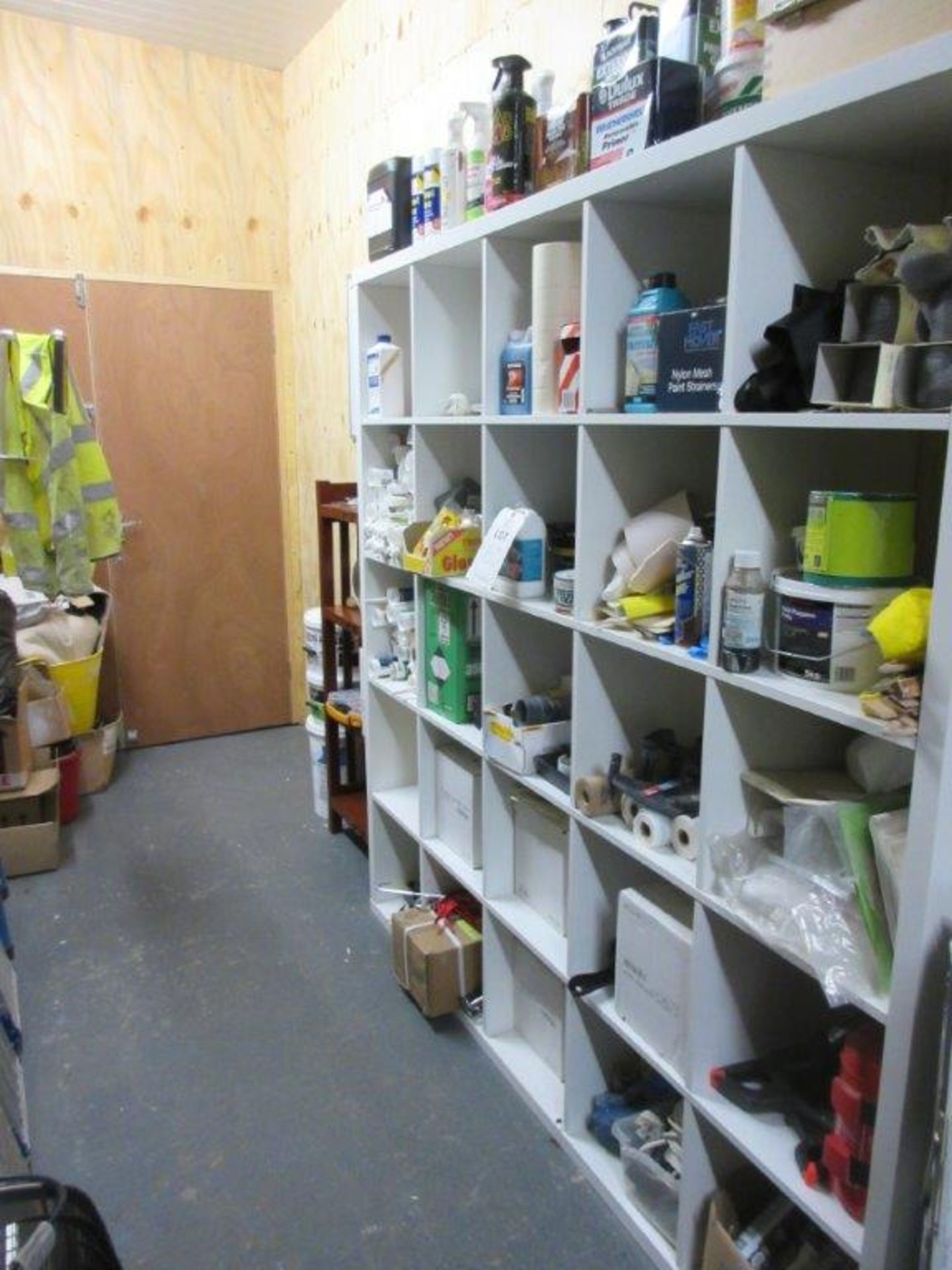 Pigeon hole and wood storage racks c/w contents including sealants, sealant guns, kettles, fire