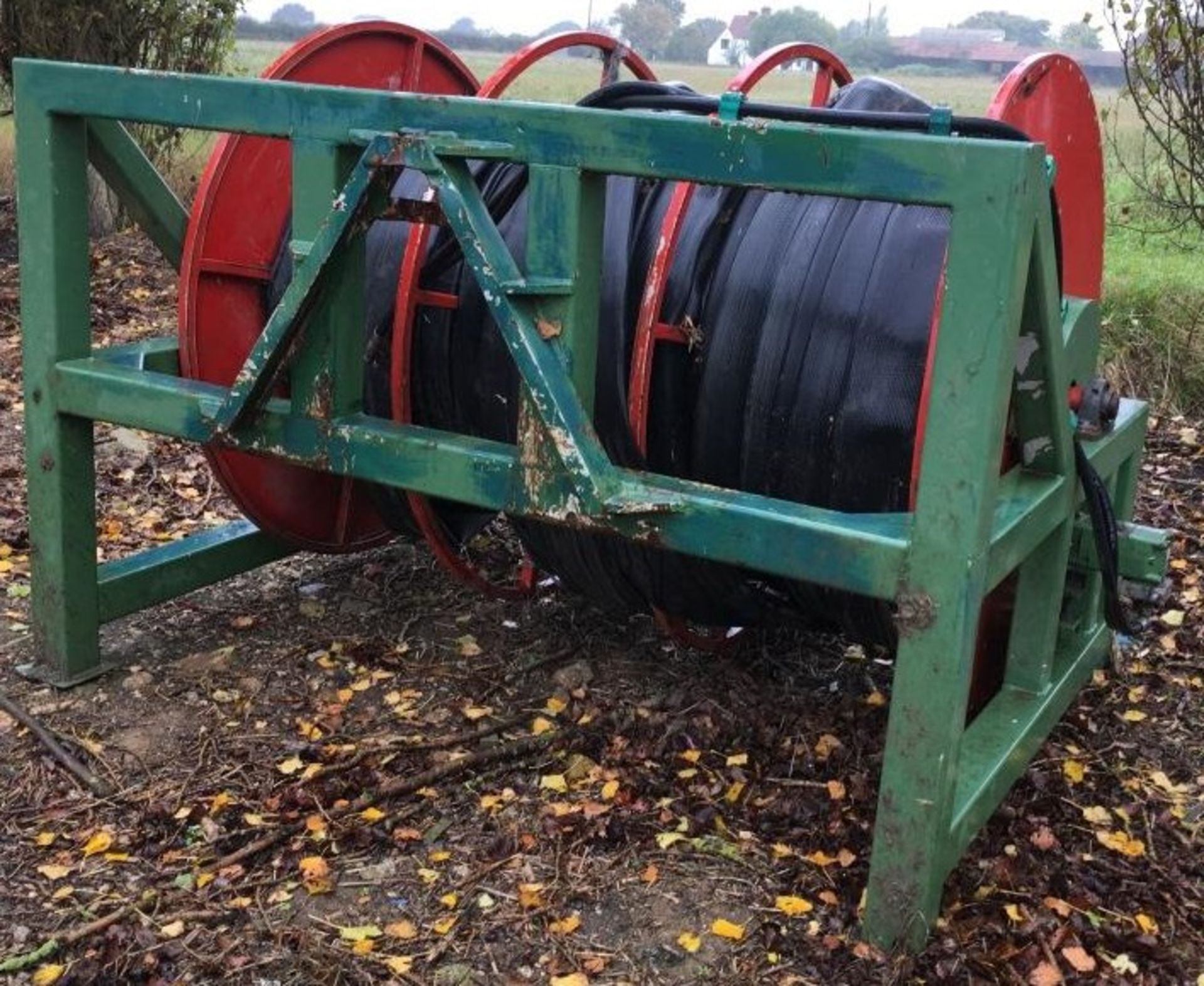 Front / rear mounted hydraulic powered hose reeler with a quantity of hose