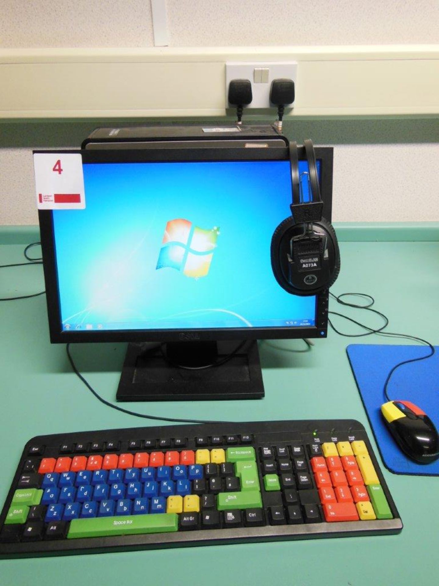 Dell Optiplex 780 desktop computer with flat screen monitor, colour keyboard and mouse incorporating