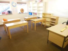 The remaining contents of the room including a wall mounted white board, wooden single pedestal