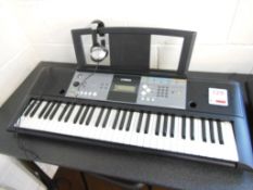 Yamaha PSR E233 electronic keyboard c/w a pair of Numark HF125 headphones. *(Lot located: