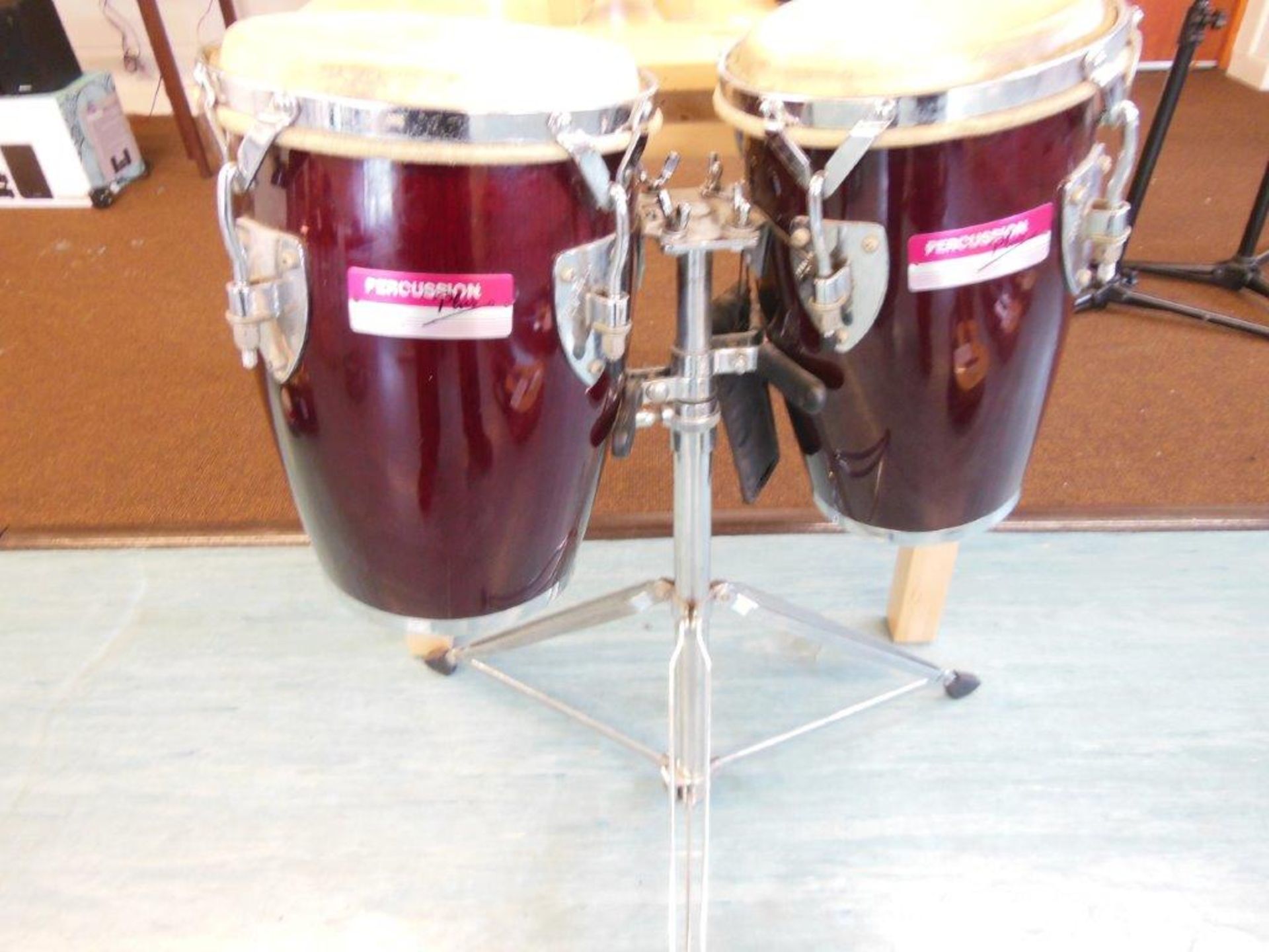 Pair of percussion plus bongo drums on stand. *(Lot located: Milverton Prep School, Park Street, - Image 2 of 2