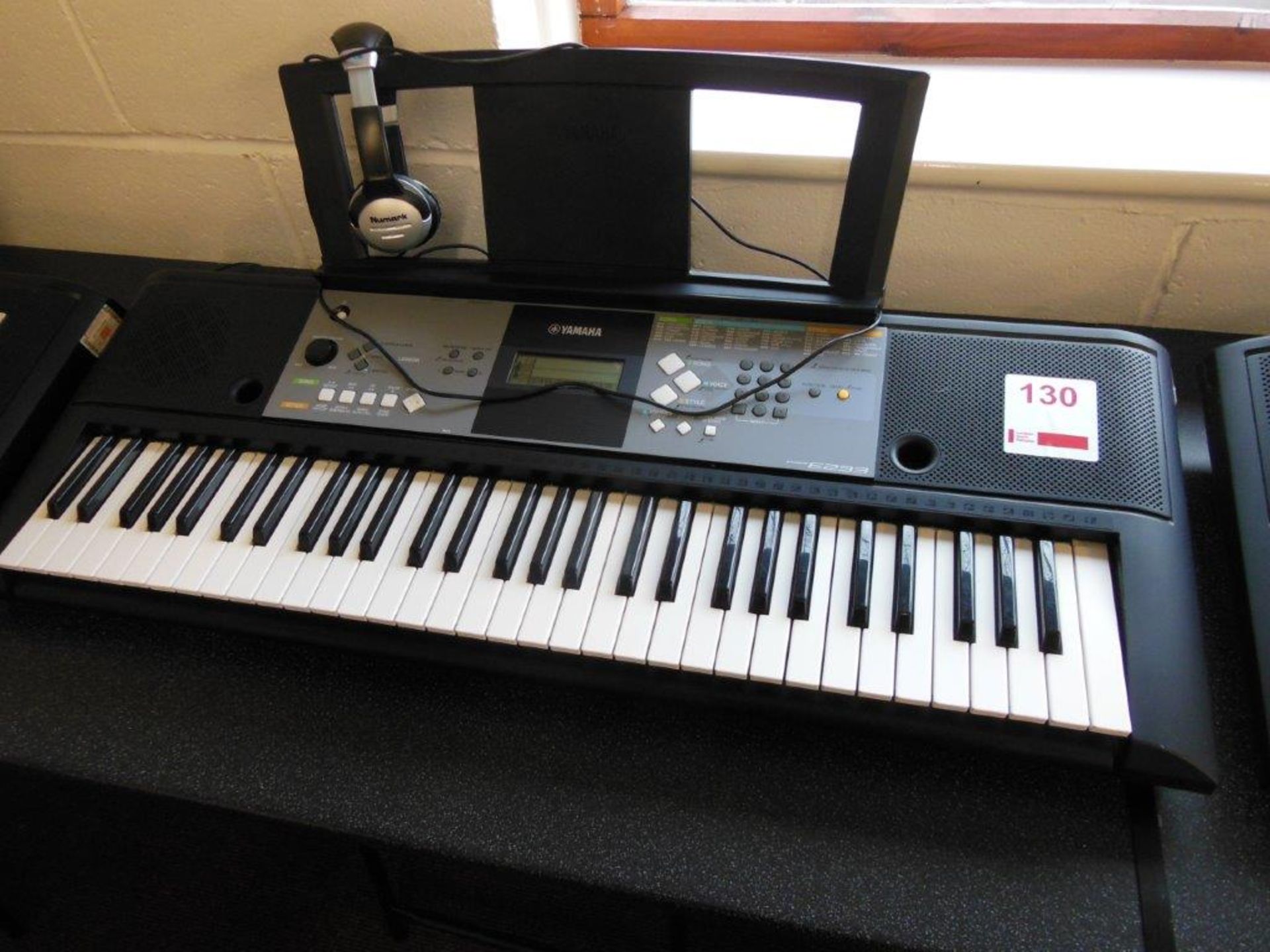 Yamaha PSR E233 electronic keyboard c/w a pair of Numark HF125 headphones. *(Lot located: