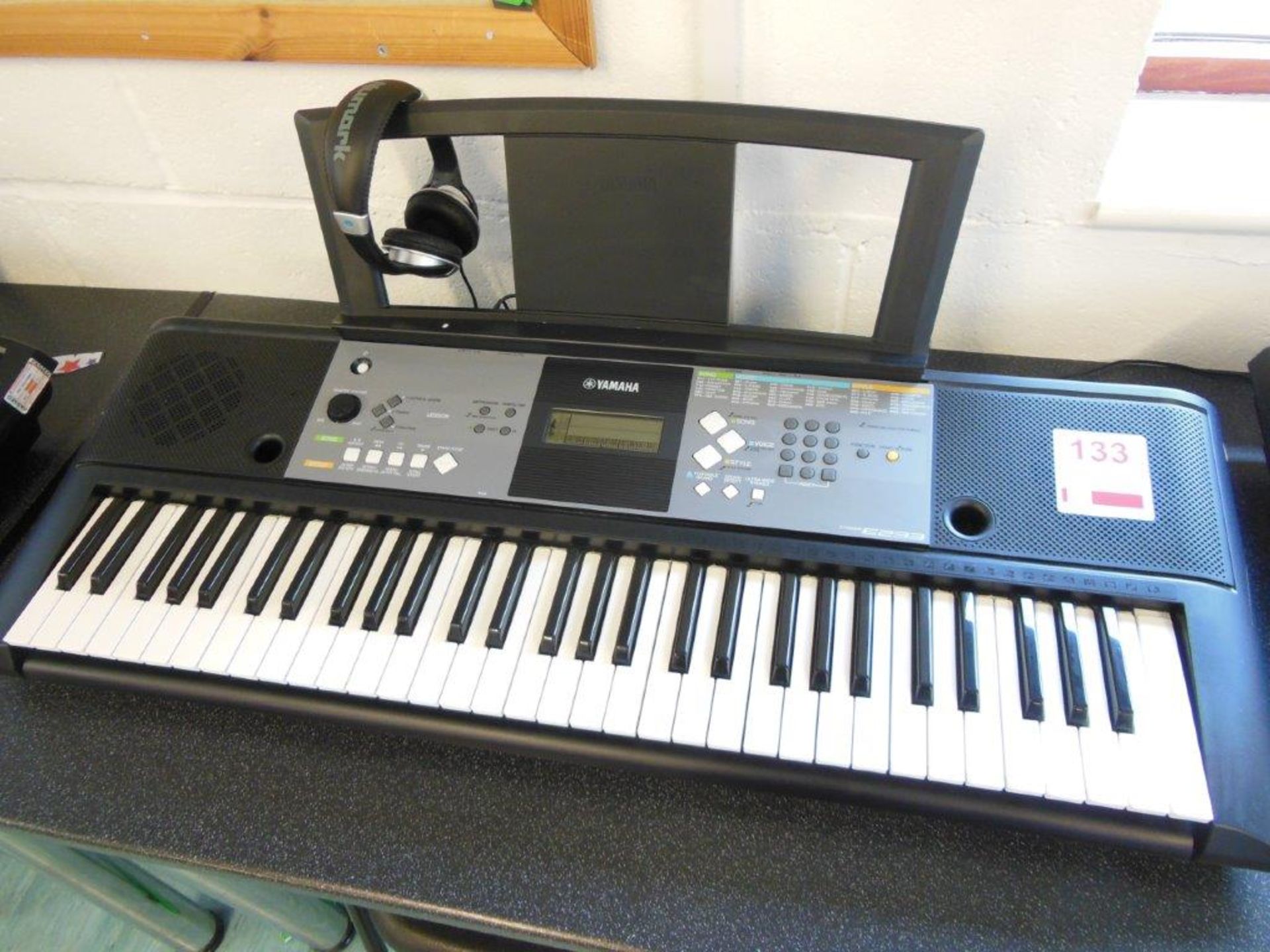 Yamaha PSR E233 electronic keyboard c/w a pair of Numark HF125 headphones. *(Lot located: