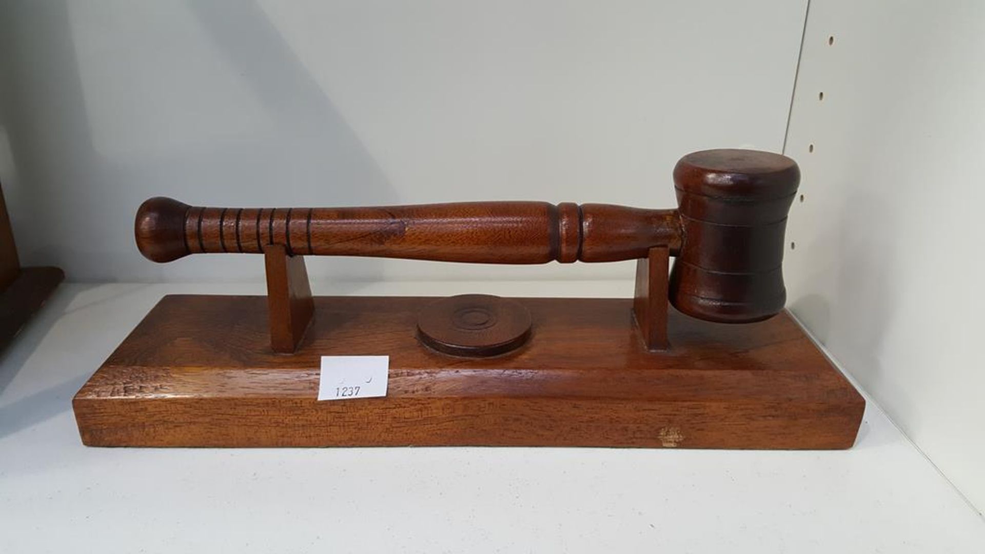 A Wooden Gavel and Base/Stand (est £20-£30)