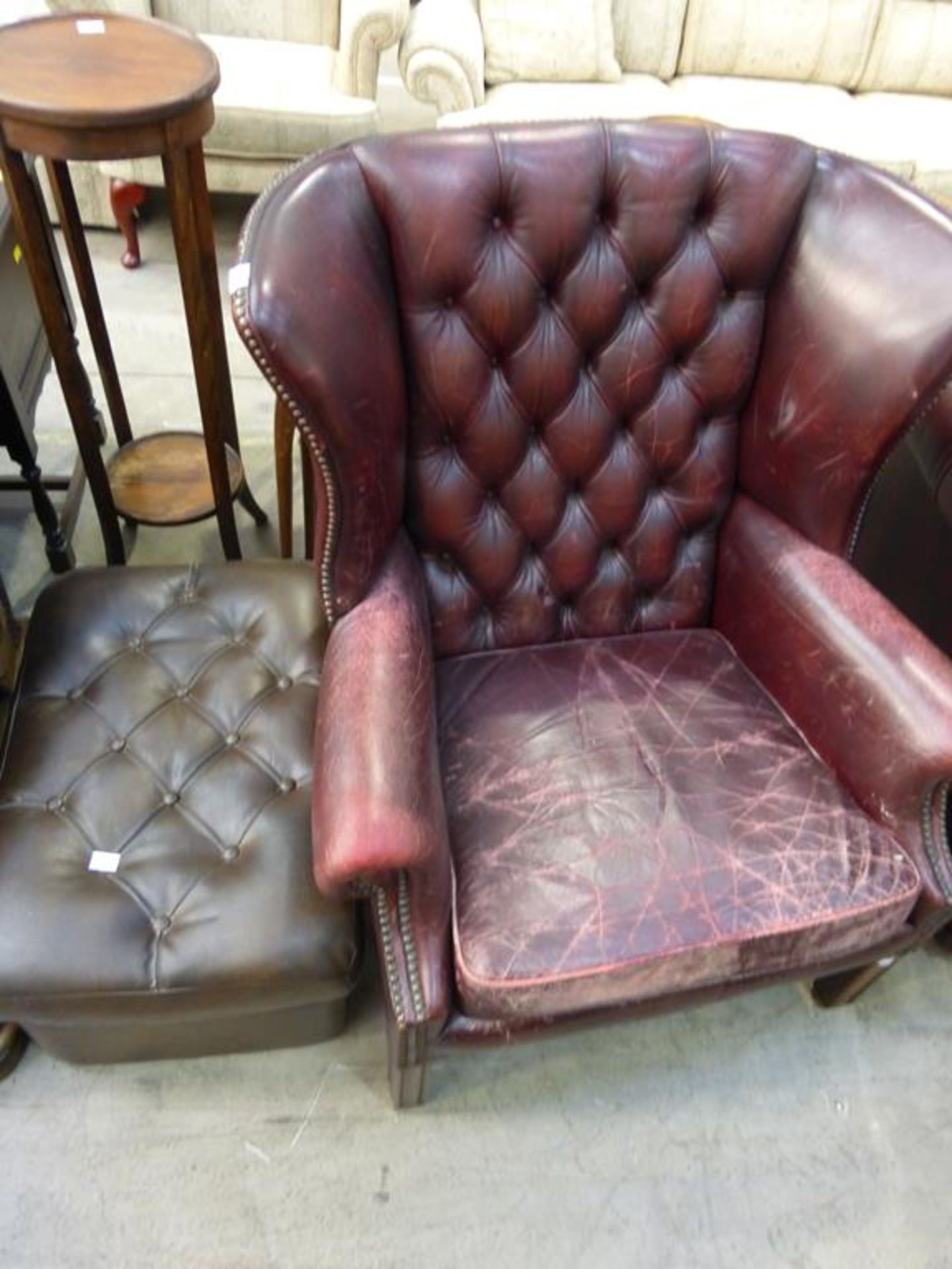 A Georgian Style brown leather buttoned back Wing Armchair together with a similar Pouffe (est £ - Image 2 of 2